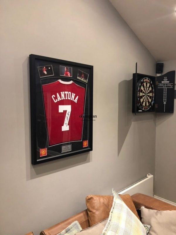 Insulated studio wall displaying Manchester United Cantona Shirt and dart board