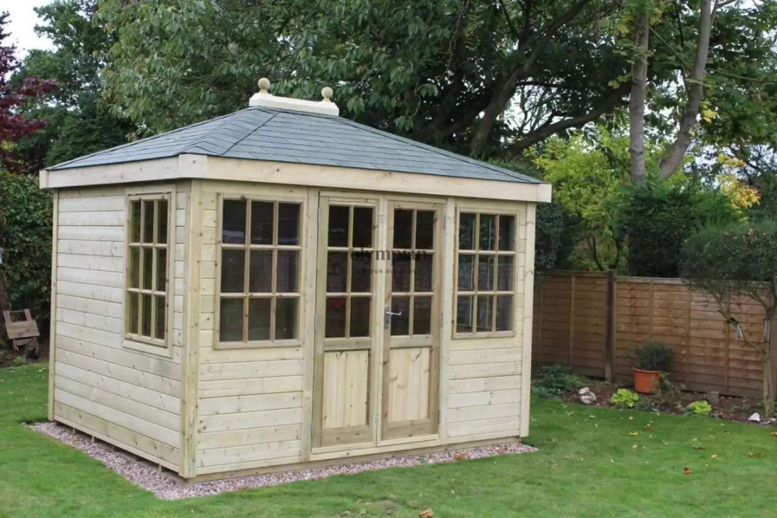 Hipped roof summerhouse with felt shingles