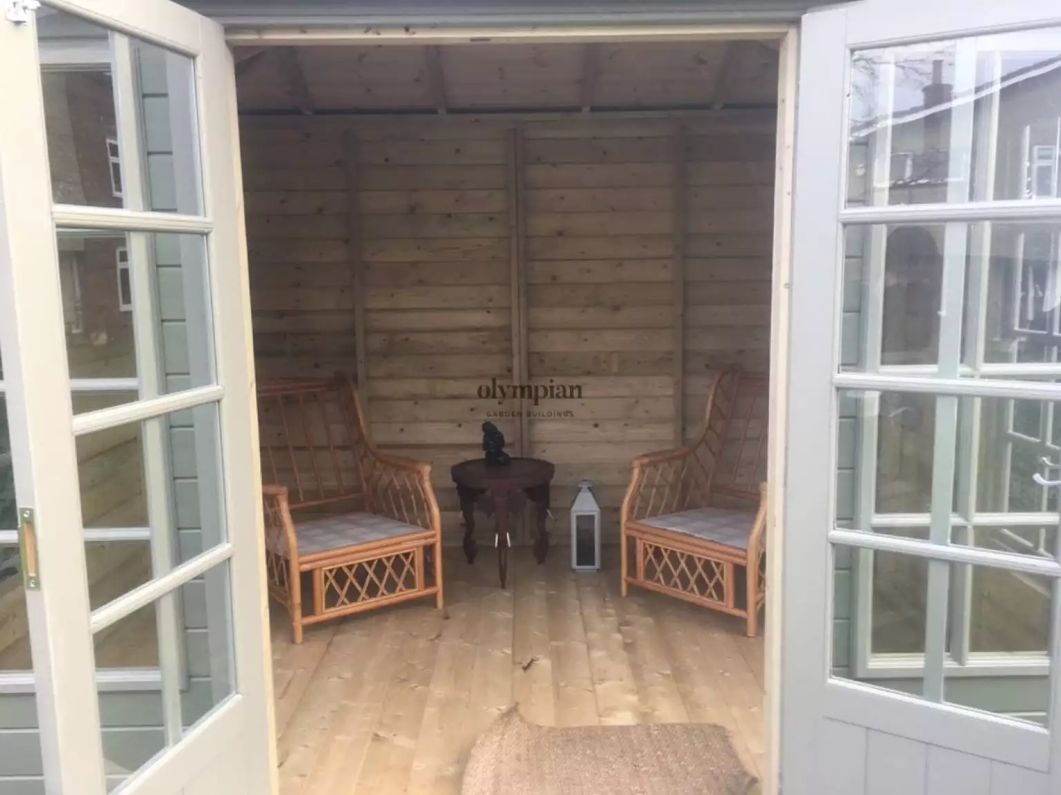 Internal view of painted hipped roof summerhouse with cedar shingles
