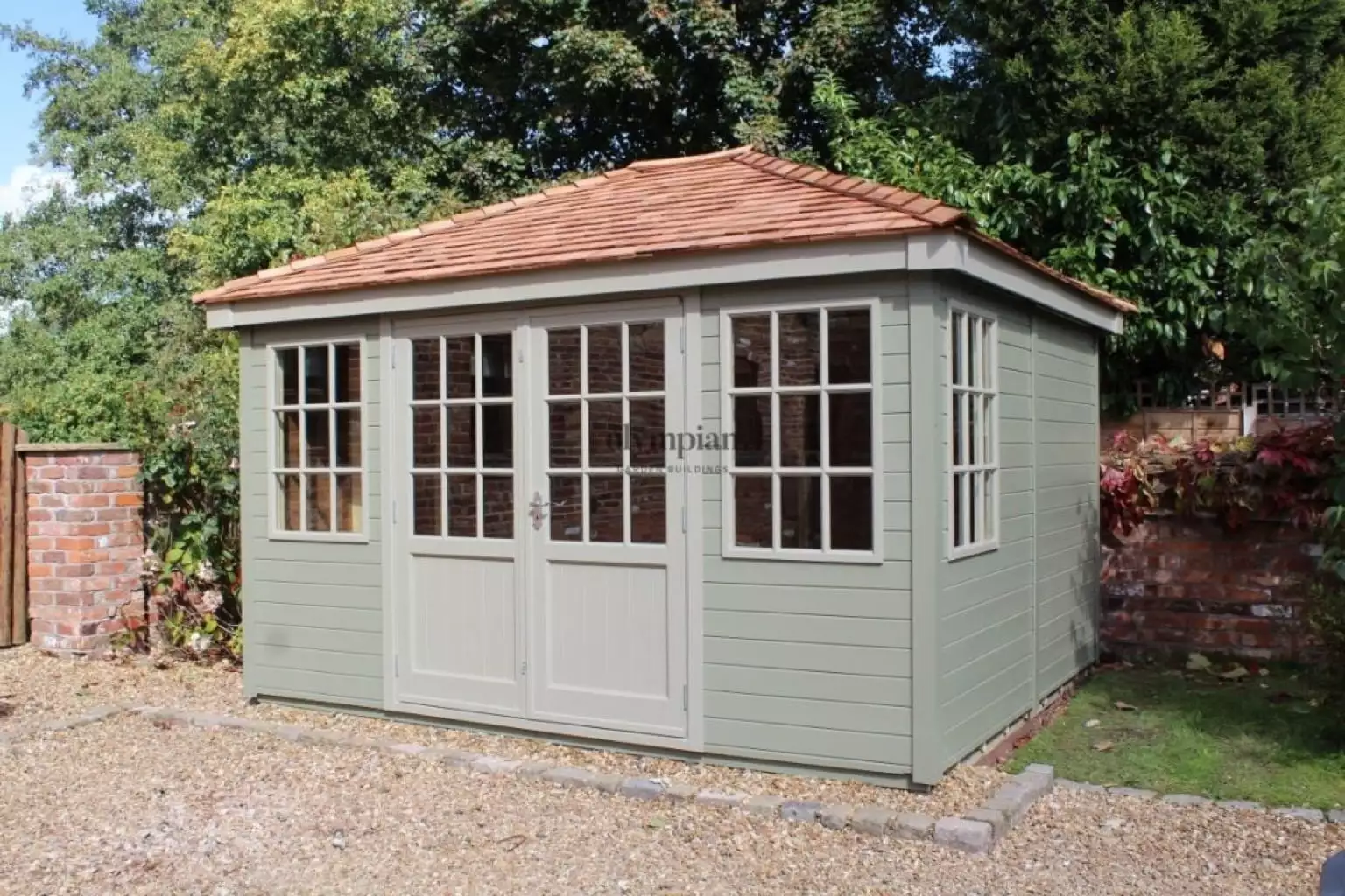 Painted hipped roof summerhouse with cedar shingles